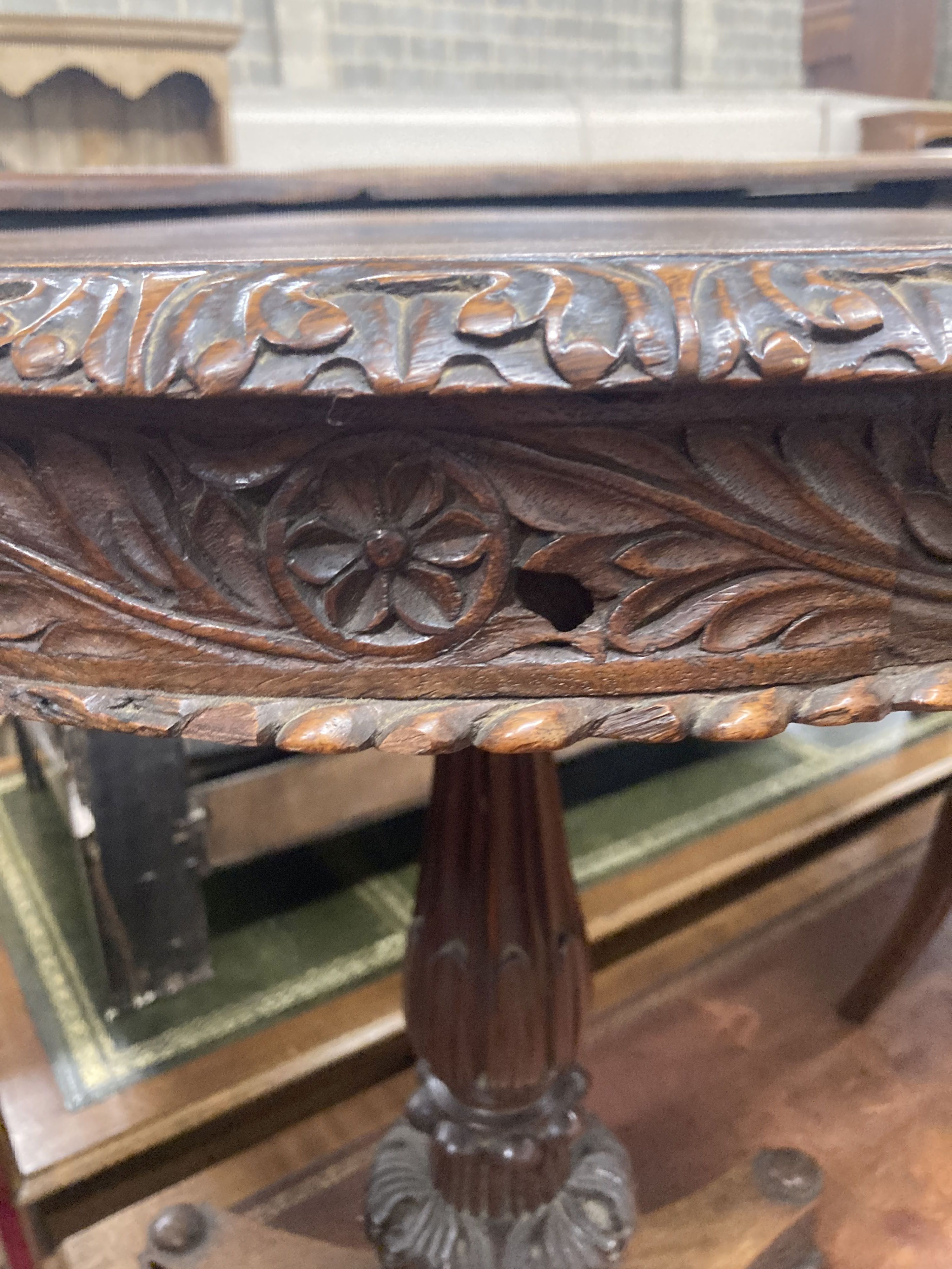 A 19th century Anglo / Indian carved padouk circular tilt top table, 60cm diameter, height 74cm